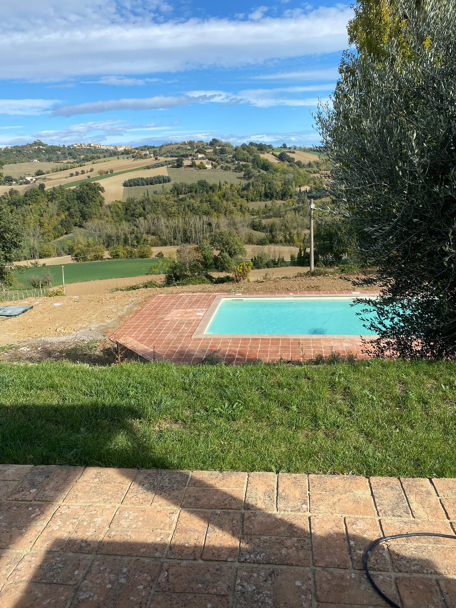 The pool on its terrace, looking out over the hills
